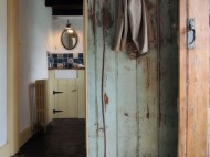 View into the bathroom, from kitchen. Photo by Under the Thatch