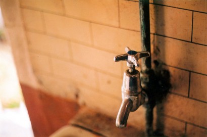 Pre renovation bathroom tap. Photo by Ben Stammers